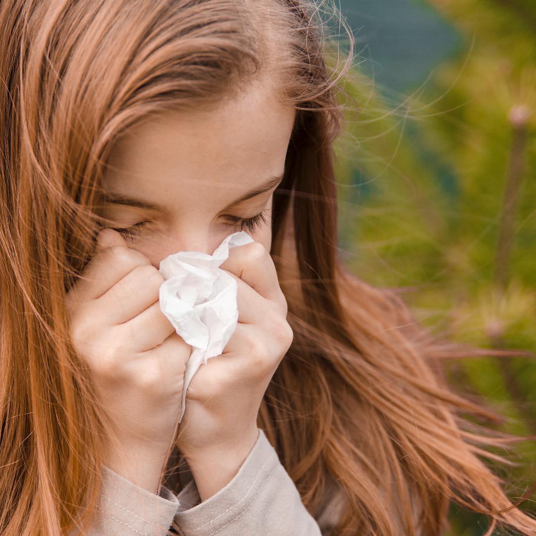 girl sneezing